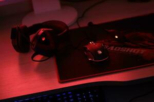 KYIV, UKRAINE - JULY 7, 2023 A4Tech Bloody G501 gaming headphones with microphone on table photo
