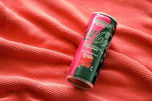 KYIV, UKRAINE - JULY 7, 2023 Coca-Cola zero sugar can with Rosalia design limited edition on red background photo