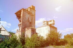 Collapsed industrial multistorey building in daytime photo