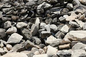 Texture of stone wall with many big brown stones photo