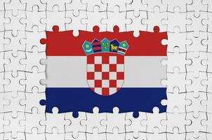 Croatia flag in frame of white puzzle pieces with missing central part photo