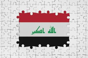 Iraq flag in frame of white puzzle pieces with missing central part photo