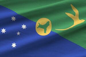 Christmas island flag with big folds waving close up under the studio light indoors. The official symbols and colors in banner photo