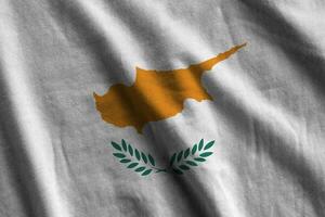 Cyprus flag with big folds waving close up under the studio light indoors. The official symbols and colors in banner photo