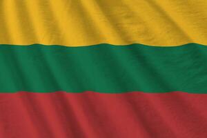 Lithuania flag with big folds waving close up under the studio light indoors. The official symbols and colors in banner photo