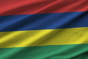 Mauritius flag with big folds waving close up under the studio light indoors. The official symbols and colors in banner photo