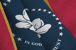 Mississippi new US state flag with big folds waving close up under the studio light indoors. The official symbols and colors in banner photo