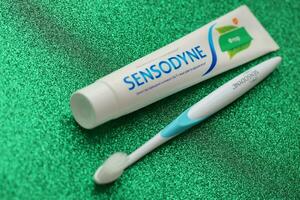 KYIV, UKRAINE - MAY 4, 2022 Sensodyne fluorine or fluor is a daily fluoride toothpaste photo