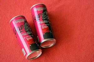 KYIV, UKRAINE - JULY 7, 2023 Coca-Cola zero sugar can with Rosalia design limited edition on red background photo