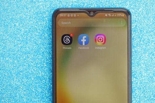 KYIV, UKRAINE - JULY 7, 2023 Threads by Meta application on display of Samsung smartphone lying on table photo