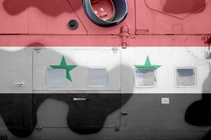 Syria flag depicted on side part of military armored helicopter closeup. Army forces aircraft conceptual background photo