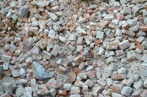 Pile of bricks and fragments of concrete from destroyed building photo