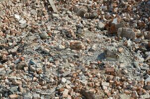 Pile of bricks and fragments of concrete from destroyed building photo