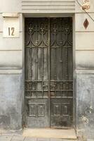 Old ancient metal door texture in european medieval style photo