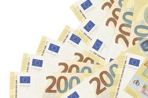 200 euro bills lies in different order isolated on white. Local banking or money making concept photo