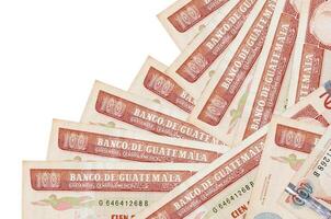 100 Guatemalan quetzales bills lies in different order isolated on white. Local banking or money making concept photo