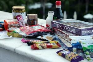 ANTALYA, TURKEY - MAY 18, 2021 Many tasty chocolate bars of various local turkish manufacturers. Typical products from turkish supermarkets photo