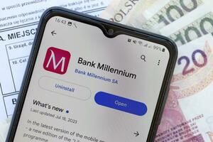 TERNOPIL, UKRAINE - AUGUST 3, 2023 Bank Millenium application on screen on modern smartphone. Official app of famous polish bank photo