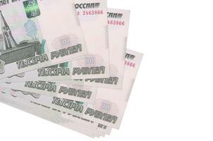 1000 russian rubles bills lies in small bunch or pack isolated on white. Mockup with copy space. Business and currency exchange photo