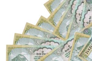 100 Nepalese rupees bills lies in different order isolated on white. Local banking or money making concept photo