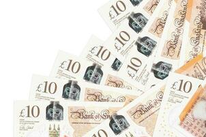 10 British pounds bills lies in different order isolated on white. Local banking or money making concept photo