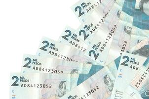 2 Colombian pesos bills lies in different order isolated on white. Local banking or money making concept photo