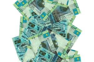 500 Kazakhstani tenge bills flying down isolated on white. Many banknotes falling with white copyspace on left and right side photo