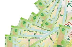 200 russian rubles bills lies in different order isolated on white. Local banking or money making concept photo