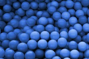 Swimming pool for fun and jumping in colored plastic balls. phantom classic blue color photo