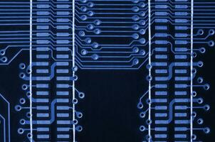 Close up of colored micro circuit board. Abstract technology background. phantom classic blue color photo