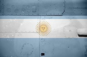 Argentina flag depicted on side part of military armored helicopter closeup. Army forces aircraft conceptual background photo