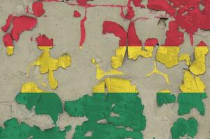 Bolivia flag depicted in paint colors on old obsolete messy concrete wall closeup. Textured banner on rough background photo