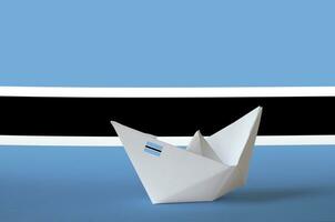 Botswana flag depicted on paper origami ship closeup. Handmade arts concept photo