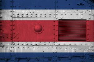 Costa Rica flag depicted on side part of military armored tank closeup. Army forces conceptual background photo