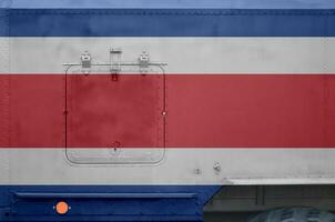 Costa Rica flag depicted on side part of military armored truck closeup. Army forces conceptual background photo