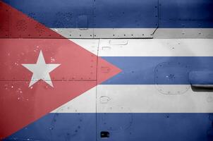 Cuba flag depicted on side part of military armored helicopter closeup. Army forces aircraft conceptual background photo