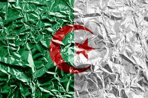 Algeria flag depicted in paint colors on shiny crumpled aluminium foil closeup. Textured banner on rough background photo