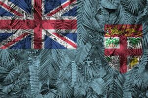 Fiji flag depicted on many leafs of monstera palm trees. Trendy fashionable backdrop photo