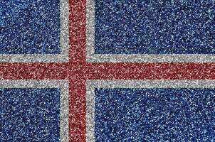 Iceland flag depicted on many small shiny sequins. Colorful festival background for party photo