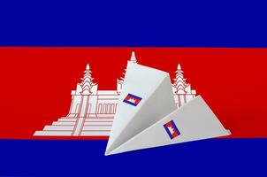 Cambodia flag depicted on paper origami airplane. Handmade arts concept photo