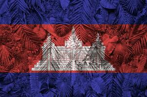 Cambodia flag depicted on many leafs of monstera palm trees. Trendy fashionable backdrop photo