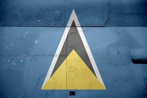 Saint Lucia flag depicted on side part of military armored helicopter closeup. Army forces aircraft conceptual background photo