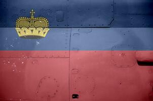 Liechtenstein flag depicted on side part of military armored helicopter closeup. Army forces aircraft conceptual background photo