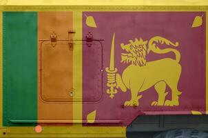 Sri Lanka flag depicted on side part of military armored truck closeup. Army forces conceptual background photo