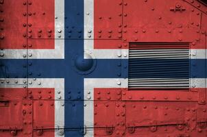 Norway flag depicted on side part of military armored tank closeup. Army forces conceptual background photo