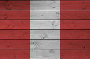 Peru flag depicted in bright paint colors on old wooden wall. Textured banner on rough background photo