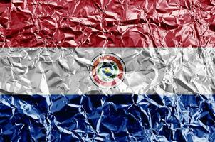 Paraguay flag depicted in paint colors on shiny crumpled aluminium foil closeup. Textured banner on rough background photo