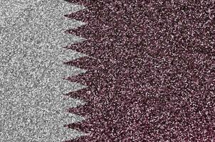 Qatar flag depicted on many small shiny sequins. Colorful festival background for party photo