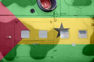 Sao Tome and Principe flag depicted on side part of military armored helicopter closeup. Army forces aircraft conceptual background photo