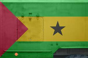 Sao Tome and Principe flag depicted on side part of military armored truck closeup. Army forces conceptual background photo